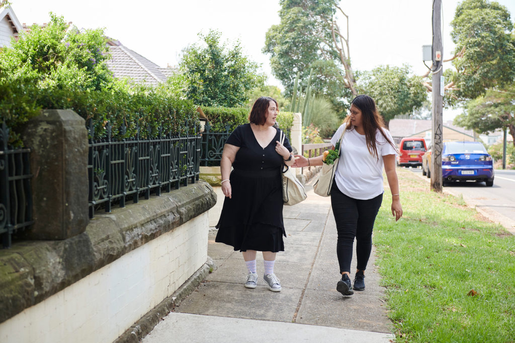 women talking in street