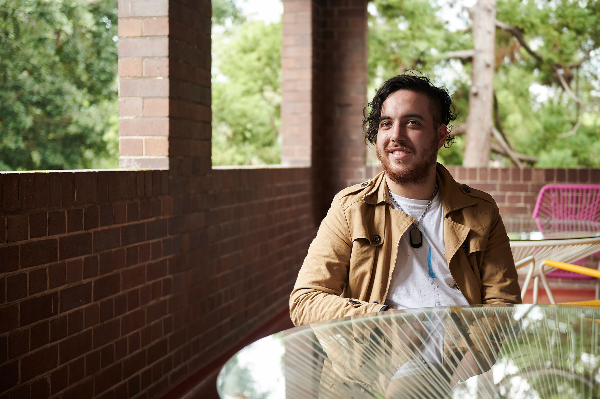 man sitting next to coffee table