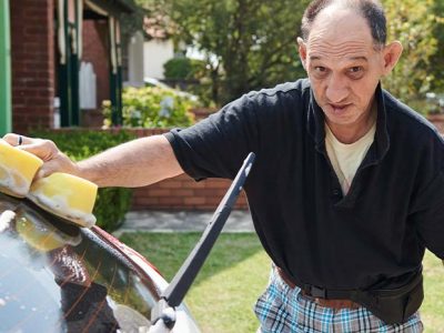 man washing car