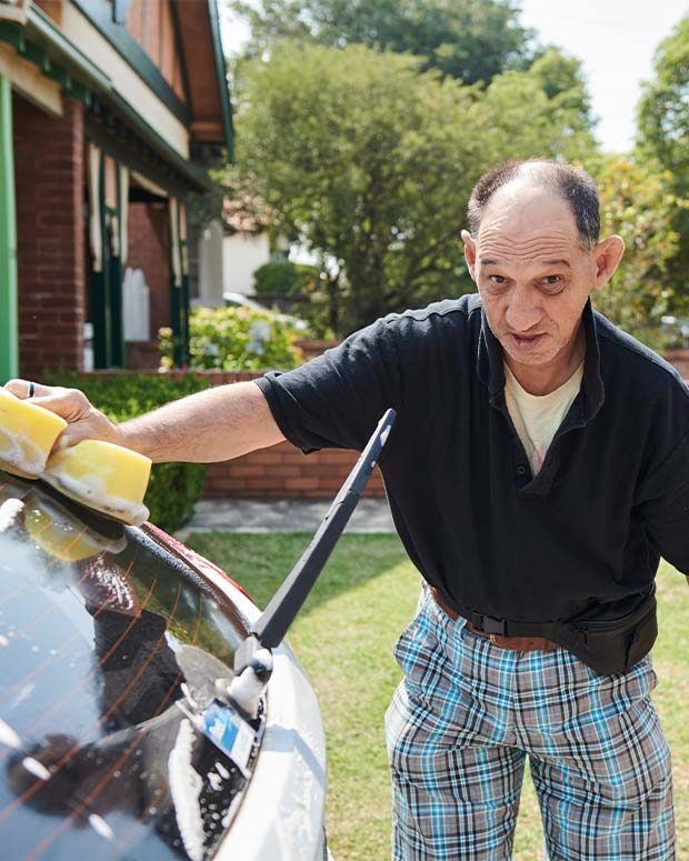 man washing car