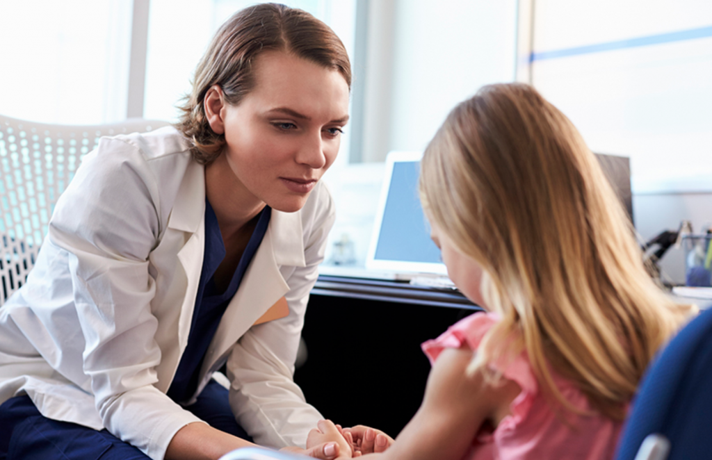 woman holding hands with a kid seeking mental health advice