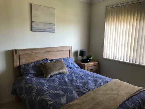 pecan bedroom with blue bedding