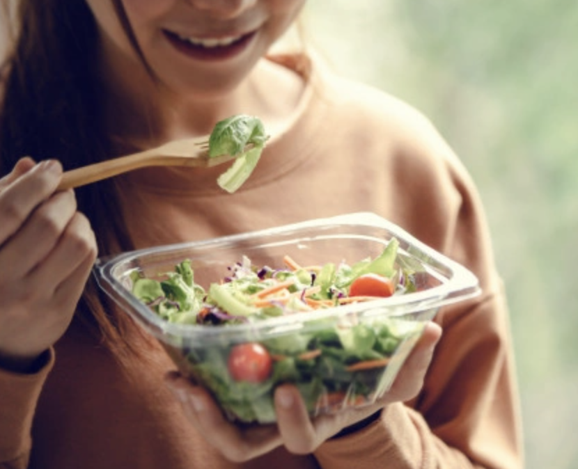 woman eating salad to negate depression and anxiety