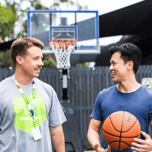 headspace worker playing basketball with participant