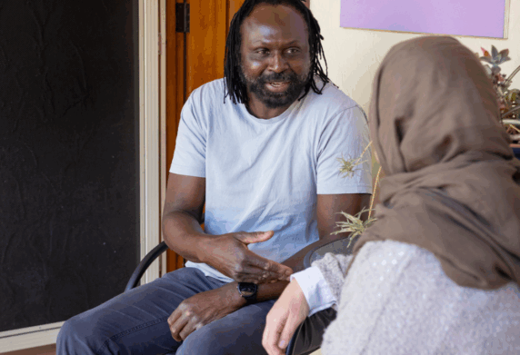 Stride Support Coordinator Sitting With Participant