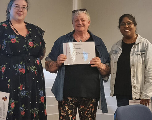 Helen holding are graduation certification