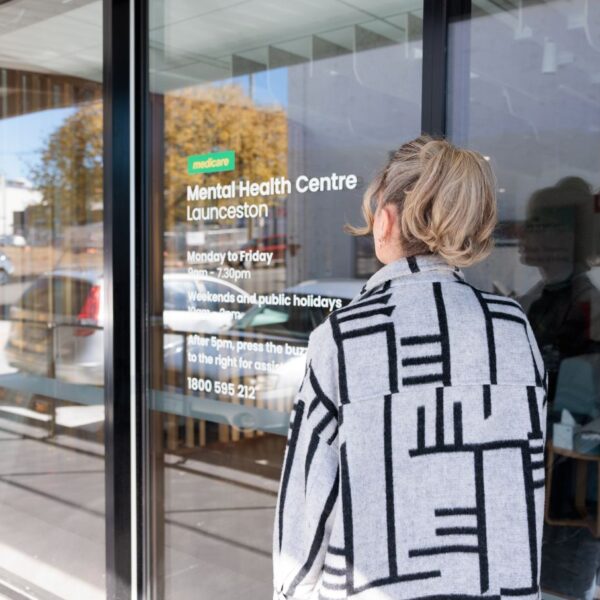 Female at entry door of Launceston Medicare Mental Health centre
