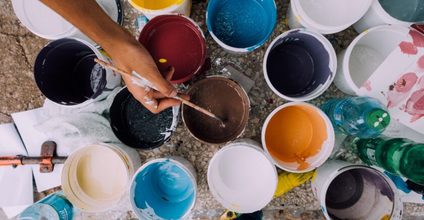 Various colours of paint in buckets