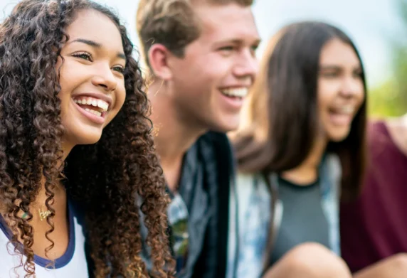 Three friends smiling