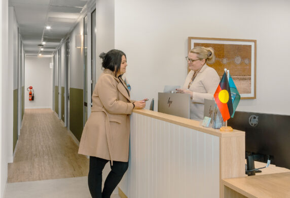 client being welcome by receptionist