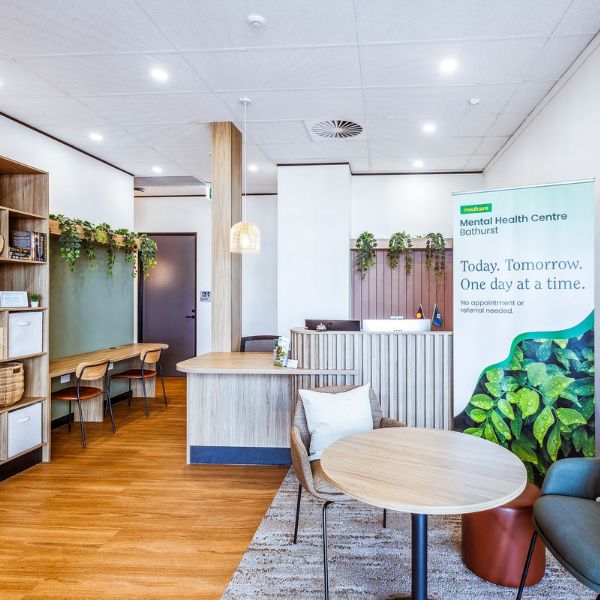 Reception area with table, lounge and an area to sit with your laptop
