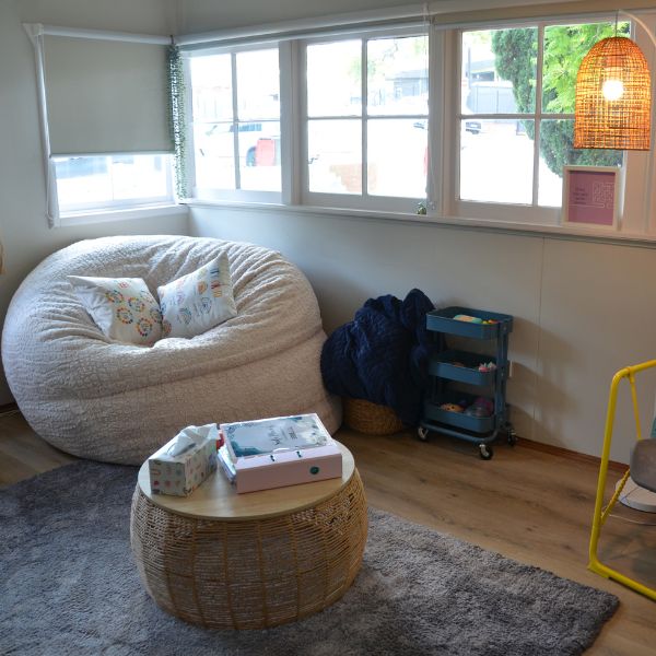 Comfortable calm space with large cream bean bag, natural lighting and alternate seating areas