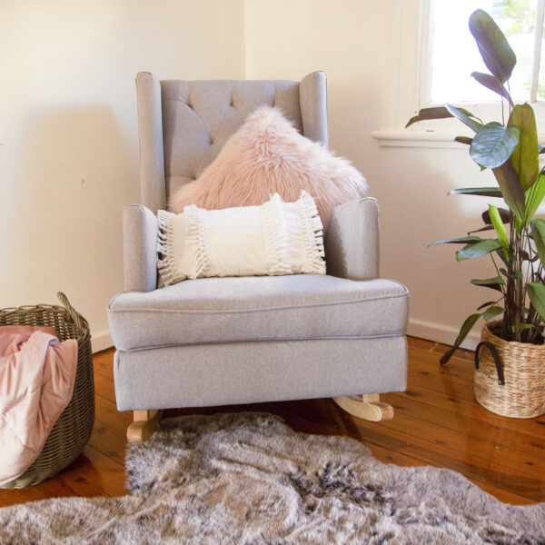 A cozy corner of safe haven with a couch and cushions.