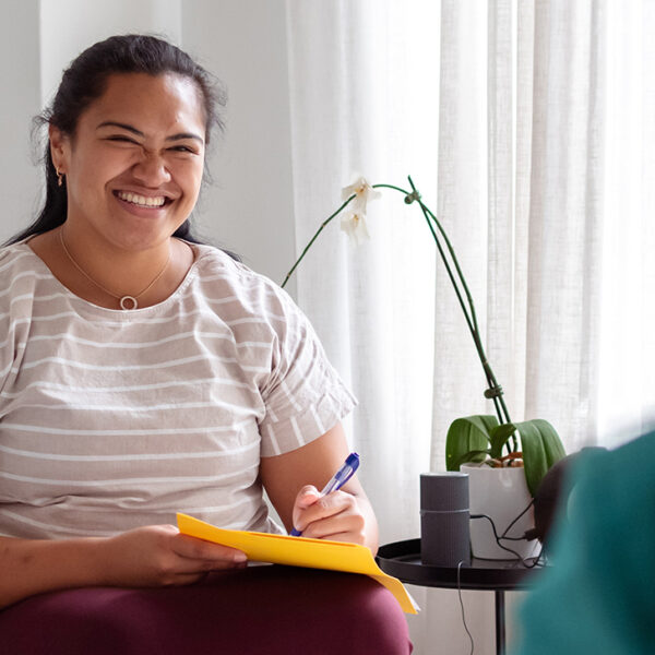 therapist smiling in consultation room