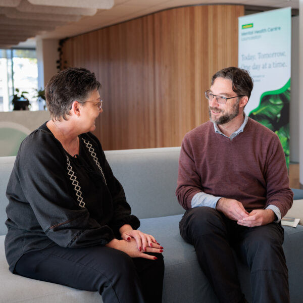 Greeted by a support worker in discussion on reception lounge
