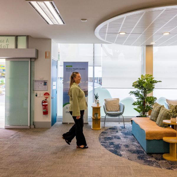 Person walking in from front door entry way to sitting area