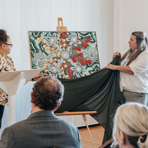 Ivette Labib Senior Wellbeing Navigator with Joanne Milson-Naden, Peer Wellbeing Navigator unveiling Nathan Peckhams beautiful indiginous artwork