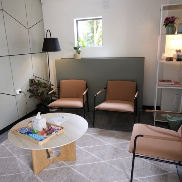 Quiet space with three peach chairs and a coffee table at the Burnie Medicare Mental Health Centre