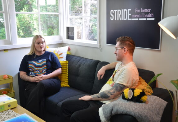 Safe Space Peer Worker on lounge talking with somebody