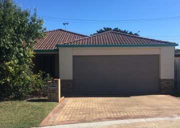 Front of house with double driveway and garage