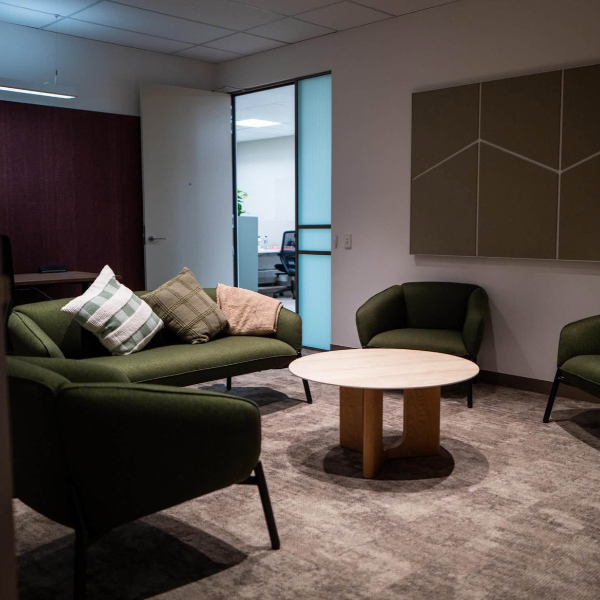 Private room with dark forest green lounges