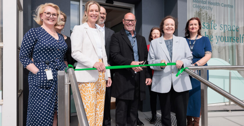 Glenorchy Staff and Government representatives cutting a green ribbon celebrating the opening.